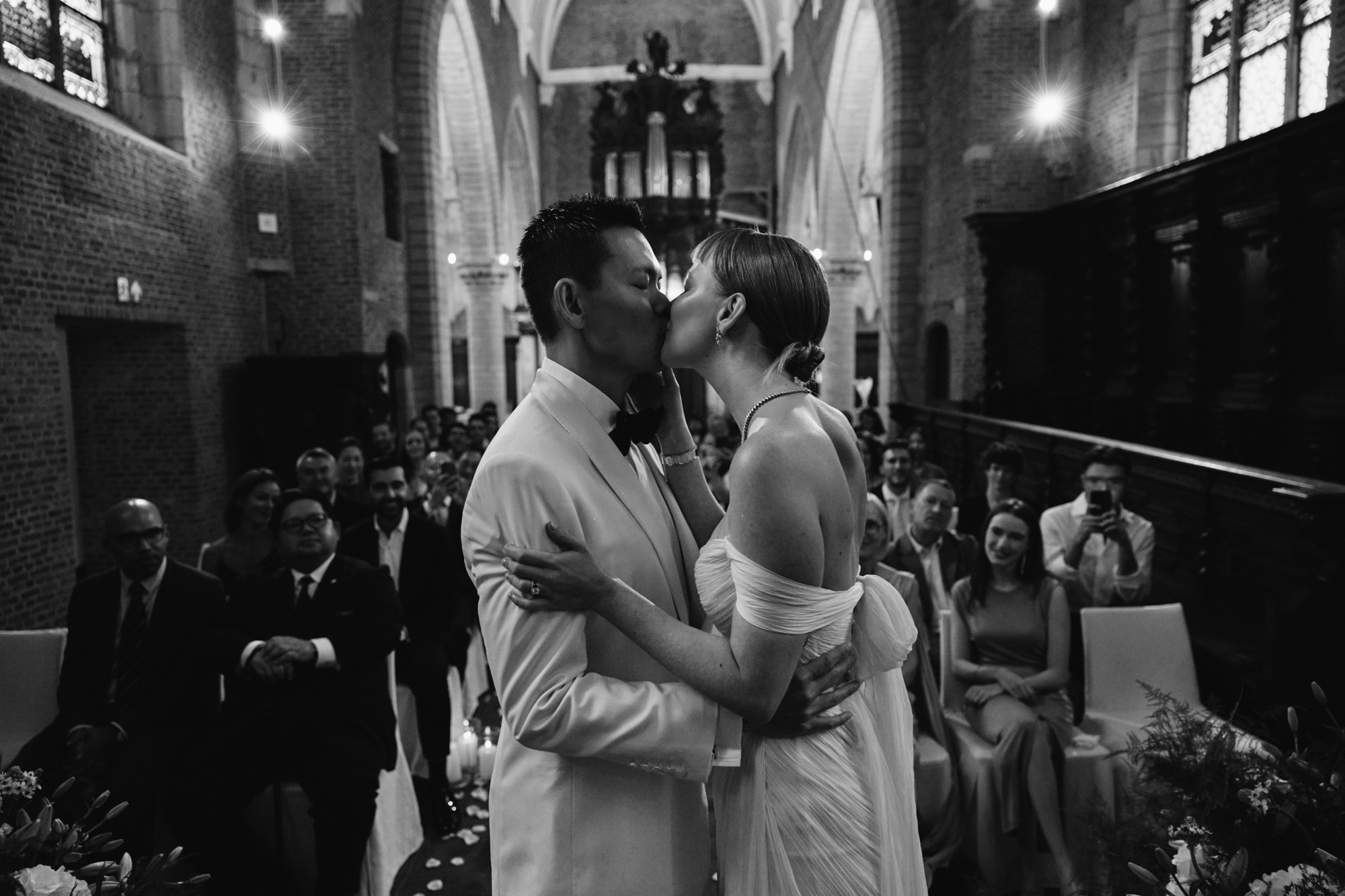 Lina and Jin kissing during their wedding ceremony