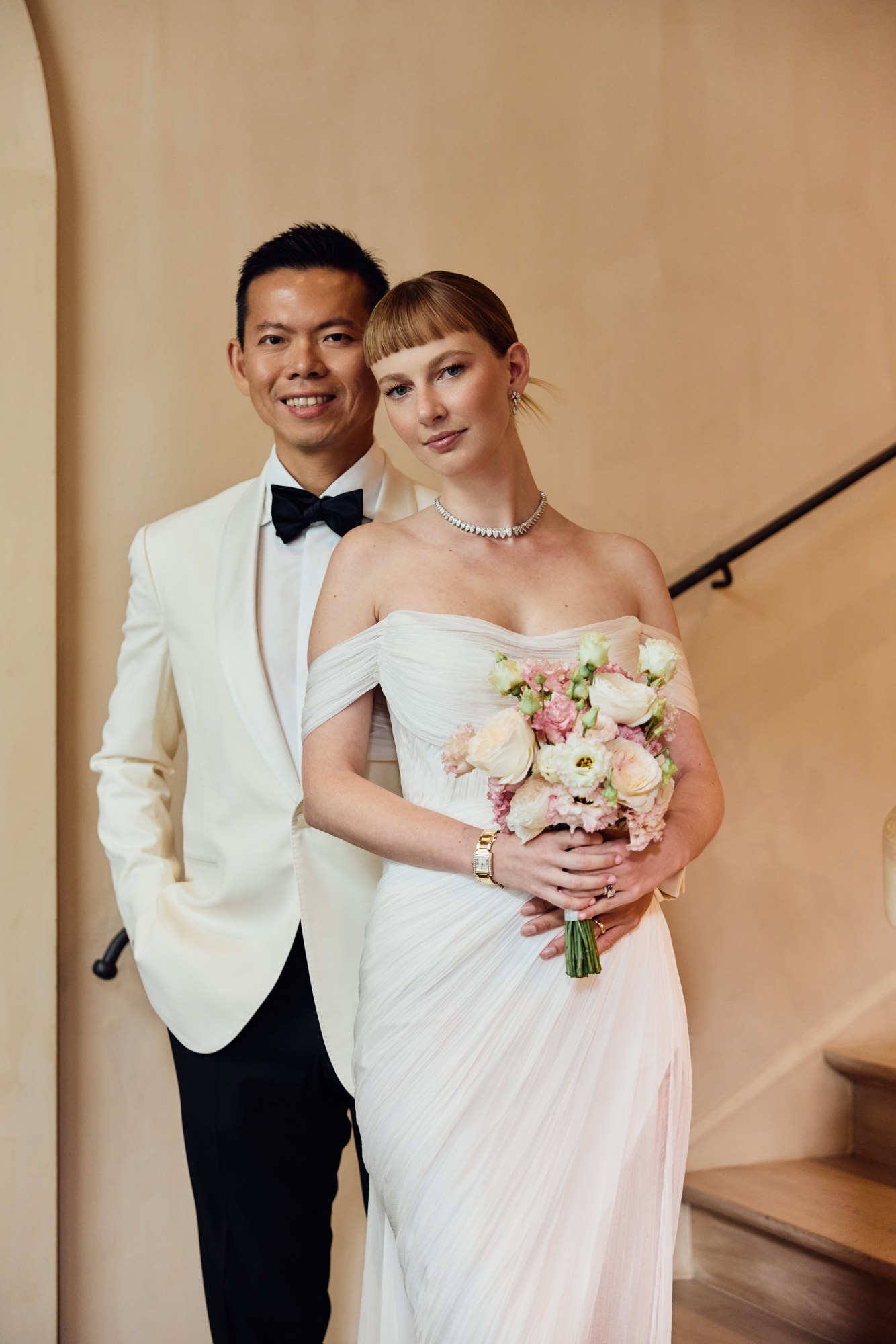 Lina and Jin with a wedding bouquet
